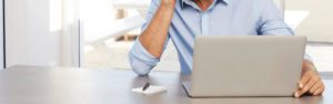 man in front of laptop