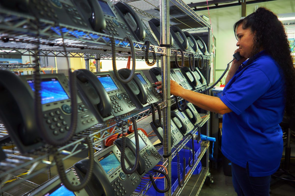 woman on phone in testing lab